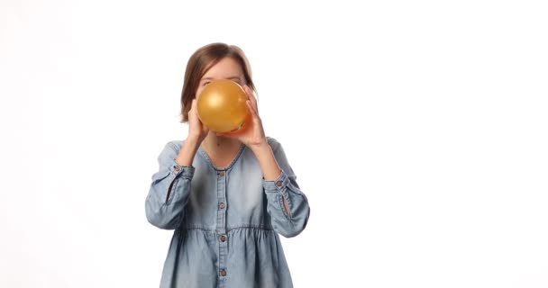Pretty Little Girl Casual Denim Dress Blowing Inflate Yellow Balloon — Αρχείο Βίντεο