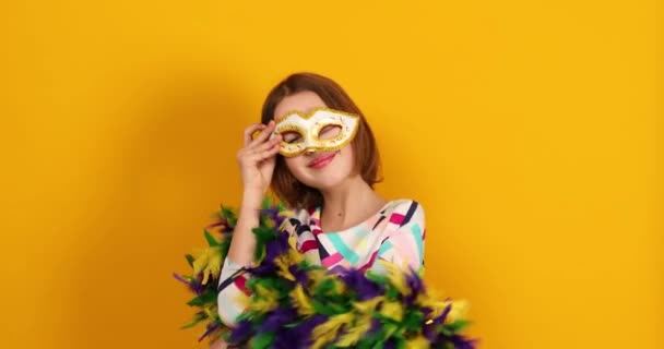 Joyful Teenager Girl Wearing Colorful Brazil Carnival Mask Posing Yellow — Αρχείο Βίντεο