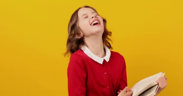 Happy Schoolgirl Reading Book Yellow Studio Background Educatin Concept Back — Stock Video