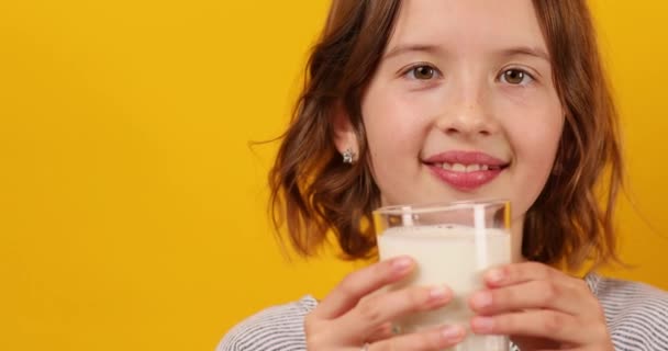 Pretty Teen Girl Child Fresh Glass Milk Isolated Studio Yellow — Stock Video