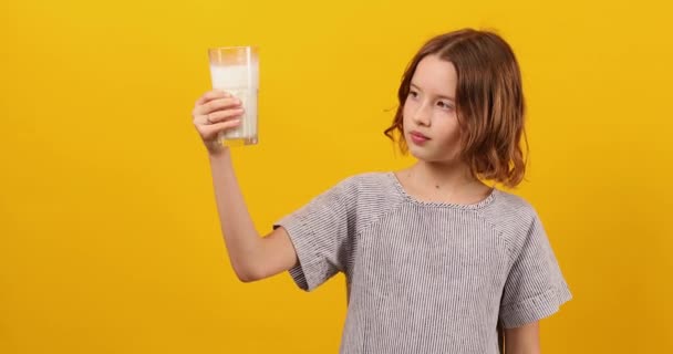 Pretty Teen Girl Child Fresh Glass Milk Isolated Studio Yellow — Stock Video