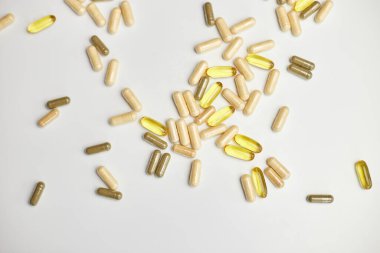 Flat lay, top view Different pharmaceutical medicine pills, tablets and capsules, on white background, Medicine concept, Heap of pills