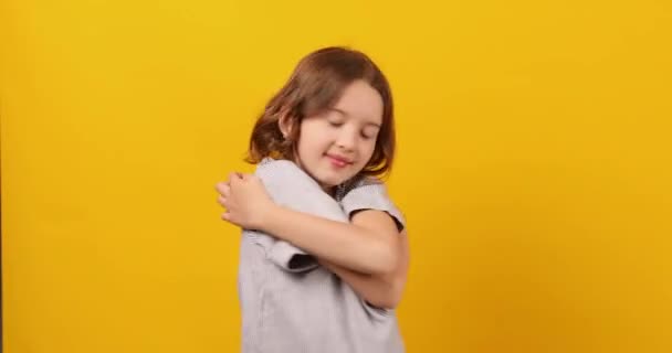 Teenage Girl Stands Her Eyes Closed Embracing Herself Hug — Stock Video
