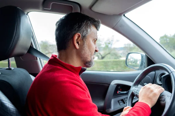 Attractive Man Driving A Car