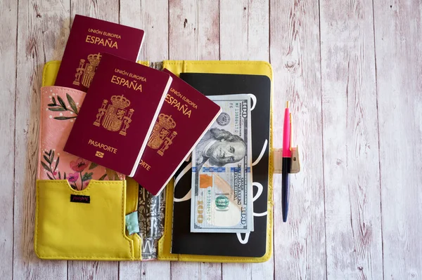 Passports with accessories and travel items on wooden background with copy space, Travel concept.