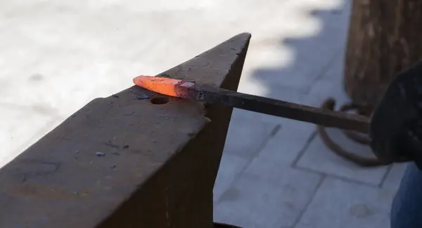 Close-up of a forge with glowing iron
