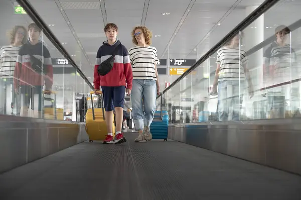 Woman Adult Teenager Walking Luggage Airport Travelator Royalty Free Stock Images