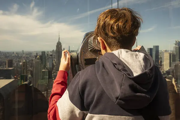 Young Adolescente Surveying New York Skyline Binoculars Royalty Free Stock Images
