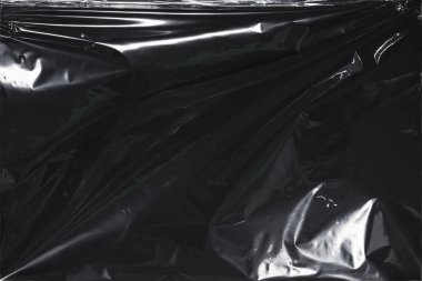 Plastik bir selofan dokuya sahip yüksek kaliteli JPEG. Benzersiz buruşuk ve şeffaf karakteri tasarımlara dokunsal bir boyut ekler. Modern şeffaf estetik için ideal.