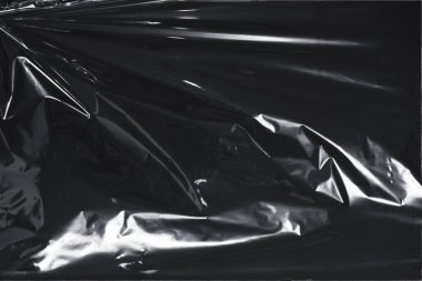 Plastik bir selofan dokuya sahip yüksek kaliteli JPEG. Benzersiz buruşuk ve şeffaf karakteri tasarımlara dokunsal bir boyut ekler. Modern şeffaf estetik için ideal.