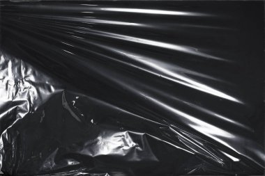 Plastik bir selofan dokuya sahip yüksek kaliteli JPEG. Benzersiz buruşuk ve şeffaf karakteri tasarımlara dokunsal bir boyut ekler. Modern şeffaf estetik için ideal.