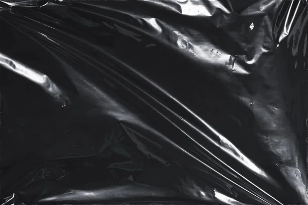 Plastik bir selofan dokuya sahip yüksek kaliteli JPEG. Benzersiz buruşuk ve şeffaf karakteri tasarımlara dokunsal bir boyut ekler. Modern şeffaf estetik için ideal.