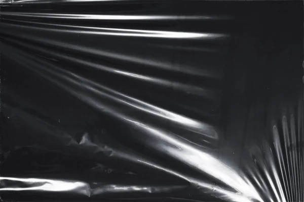 Plastik bir selofan dokuya sahip yüksek kaliteli JPEG. Benzersiz buruşuk ve şeffaf karakteri tasarımlara dokunsal bir boyut ekler. Modern şeffaf estetik için ideal.