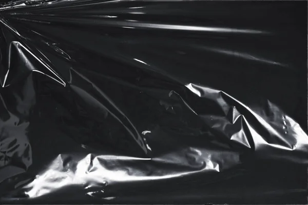 Plastik bir selofan dokuya sahip yüksek kaliteli JPEG. Benzersiz buruşuk ve şeffaf karakteri tasarımlara dokunsal bir boyut ekler. Modern şeffaf estetik için ideal.