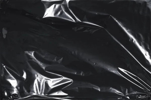 Plastik bir selofan dokuya sahip yüksek kaliteli JPEG. Benzersiz buruşuk ve şeffaf karakteri tasarımlara dokunsal bir boyut ekler. Modern şeffaf estetik için ideal.