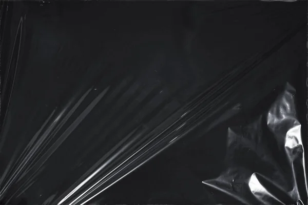 Plastik bir selofan dokuya sahip yüksek kaliteli JPEG. Benzersiz buruşuk ve şeffaf karakteri tasarımlara dokunsal bir boyut ekler. Modern şeffaf estetik için ideal.