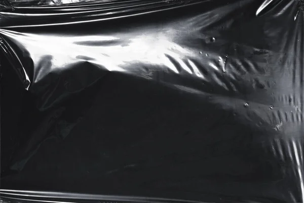 Plastik bir selofan dokuya sahip yüksek kaliteli JPEG. Benzersiz buruşuk ve şeffaf karakteri tasarımlara dokunsal bir boyut ekler. Modern şeffaf estetik için ideal.