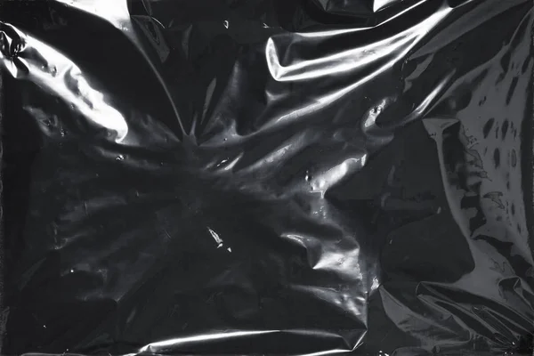 Plastik bir selofan dokuya sahip yüksek kaliteli JPEG. Benzersiz buruşuk ve şeffaf karakteri tasarımlara dokunsal bir boyut ekler. Modern şeffaf estetik için ideal.