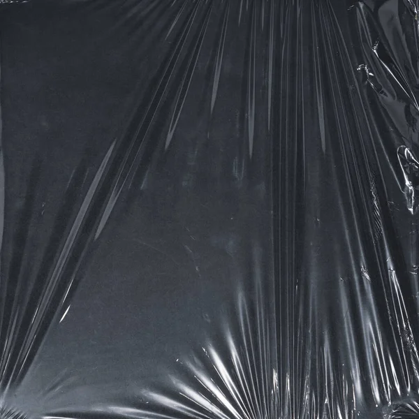 Plastik bir selofan dokuya sahip yüksek kaliteli JPEG. Benzersiz buruşuk ve şeffaf karakteri tasarımlara dokunsal bir boyut ekler. Modern şeffaf estetik için ideal.