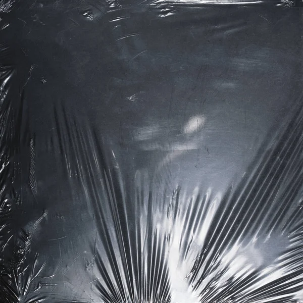 Plastik bir selofan dokuya sahip yüksek kaliteli JPEG. Benzersiz buruşuk ve şeffaf karakteri tasarımlara dokunsal bir boyut ekler. Modern şeffaf estetik için ideal.