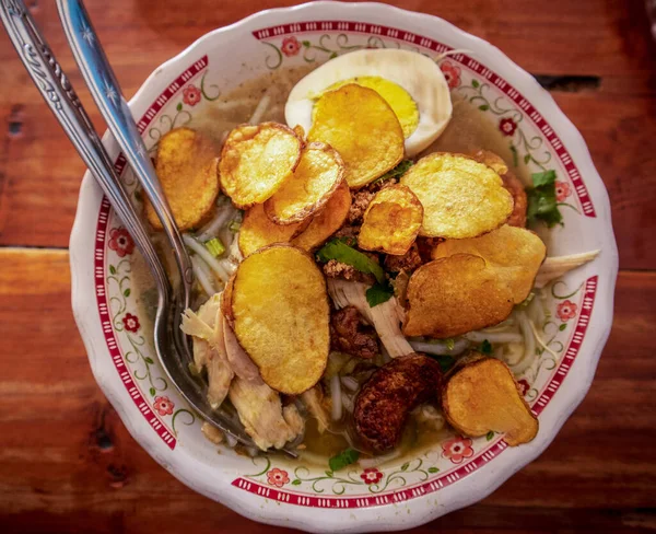 stock image Indonesian Chicken soup or Soto Ayam  is a traditional Indonesian food with a yellowish gravy.