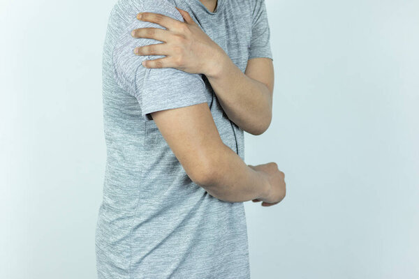Man suffering from shoulder pain on white background