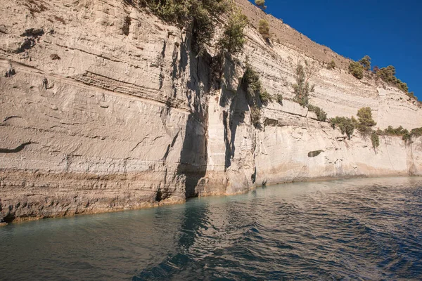 The natural origin mainly of limestone wall of the Corinth Canal in Greece. Corinth Canal connects the Gulf of Corinthn in the Ionian Sea with the Saronic Gulf in the Aegean Sea. Horizontal.