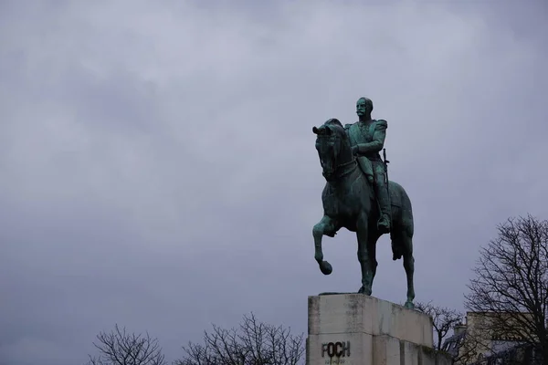 Statue of man on horse in the city of Paris