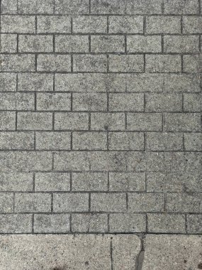 Beton tuğla duvar dokusu. Arka plan pürüzlü ve yırtık.