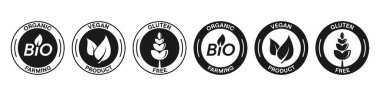Biyoloji, vegan, glütensiz siyah vektör seti. İzole edilmiş gıda ambalaj pulu ikonları. Organik tarım, vegan ürünler, glütensiz semboller koleksiyonu. Ürün sertifika işaretleri, vektör illüstrasyonu.