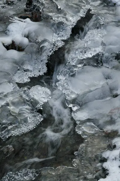 From above, ice glistens like shards of glass amidst shimmering expanses of water