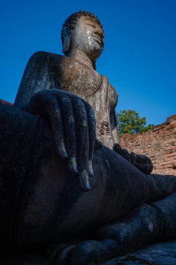 Historical sites ancient temple ruins Wat Si Chum and Wat Mahathat city of Sukhothai Historical Park, Sukhothai province, Thailand clipart
