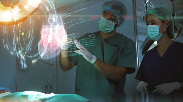 Futuristic simulation operating room - a surgeon diagnosing a senior woman\'s heart problem via a holographic heart scan simulation before surgical procedure. Concept hospital care