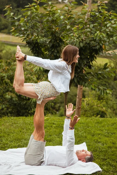 Girl Her Fathers Feet Practicing Acroyoga Happily Nature Vertical Photo — 스톡 사진