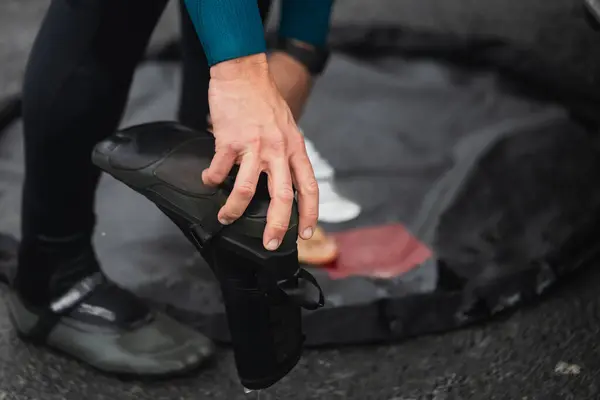 Close Surfer Hands Adjusting Neoprene Wetsuit Boots Mat Beach — Stock Photo, Image
