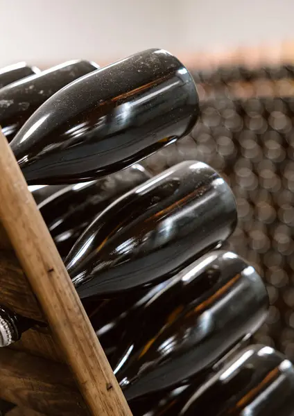 Close Dust Covered Wine Bottles Wooden Racks Aging Gracefully Dark — Stock Photo, Image