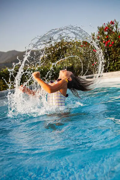 Young Girl Energetically Jumping Swimming Pool Creating Dramatic Splash Mountainous Imagen De Stock