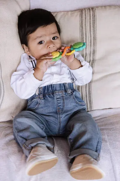 Adorable Baby Boy Sitting Sofa Dressed White Shirt Blue Denim Imágenes De Stock Sin Royalties Gratis
