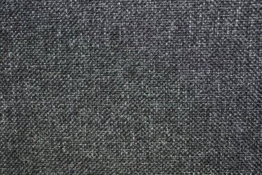 Koyu gri kumaş dokusu. Arka planda koyu gri kumaş var. Üs için koyu gri arka plan. Gri kumaş dokusu
