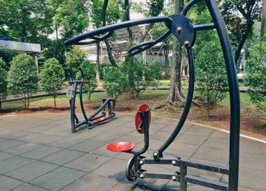Pull chair at outdoor gym in Taman Lansia Park - Jagakarsa, Jakarta. Fresh Outdoor gymnastic workout equipment.
