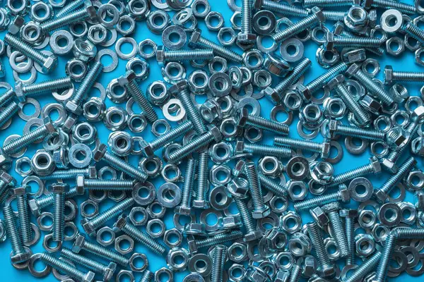 Metal Fixture Kit Home Use Bolts Nuts Insulated Blue Background — Stock Photo, Image