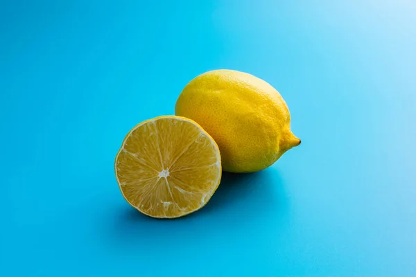 Ripe juicy lemon isolated on a blue background
