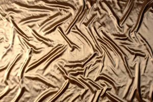 Altın dalgalı saten kumaş arkaplan
