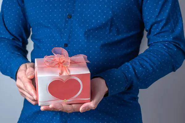 Valentine\'s Day gift in the hands of a man