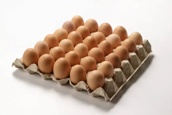 stock image Eggs in paper tray isolated on white