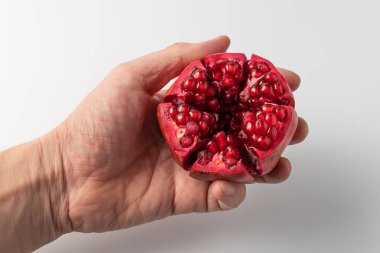 Peeled pomegranate seeds, close-up photo. clipart