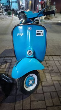 A Ride Through Time: The Vintage Bajaj Scooter in Focus clipart