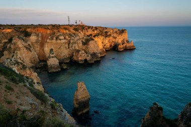 beautiful sunset over the sea in the algarve, portugal clipart