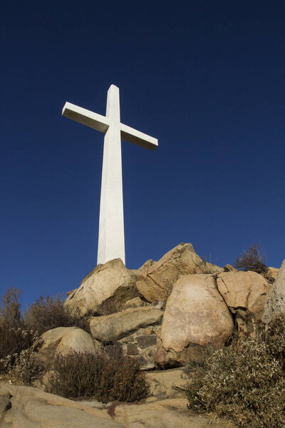 White cross on stone Calvary hill
