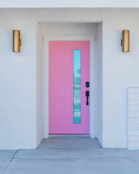 Pink door entry of a mid-century modern house in Palm Springs, California